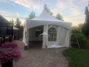 Frame tent with sidewalls in yard